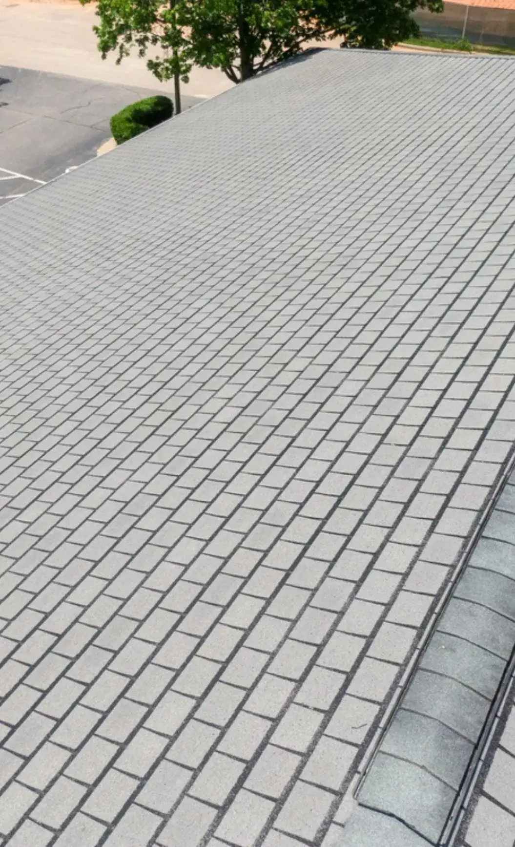 Close-up view of a newly installed asphalt shingle roof.